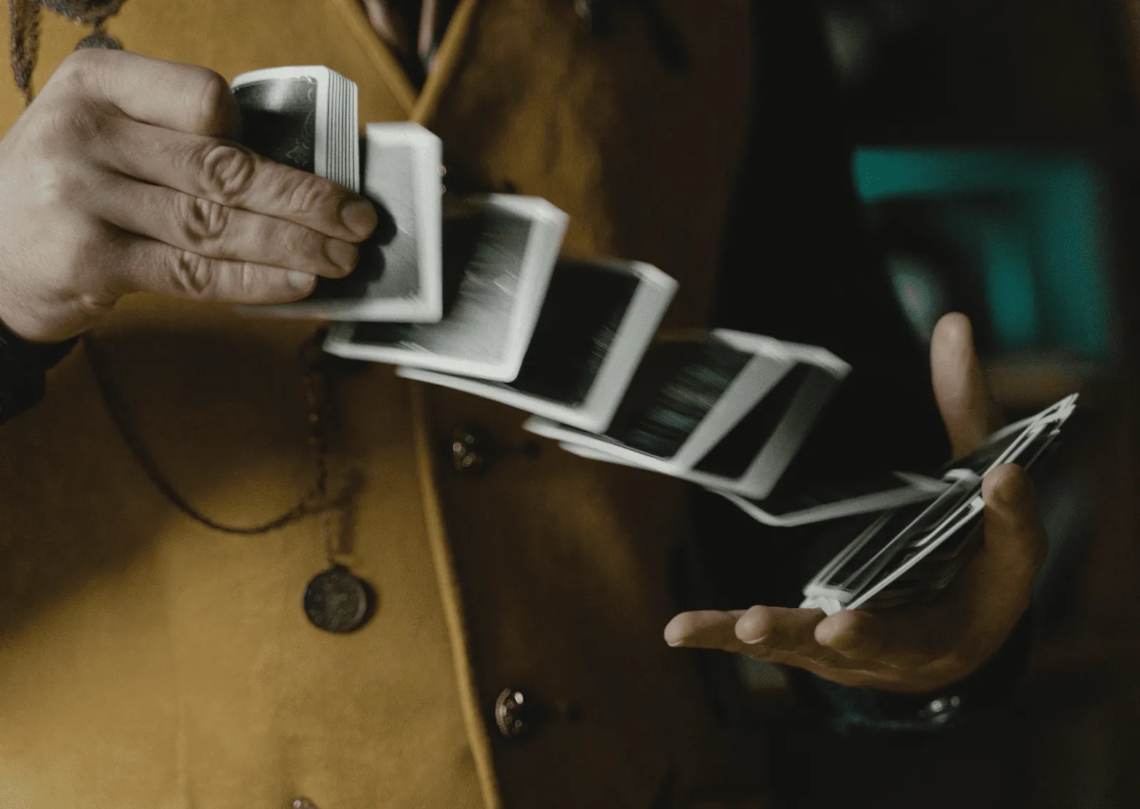 Magician fanning playing cards in a close up trick