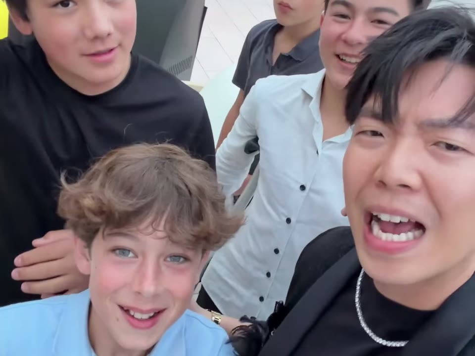 Johnny Wu with the teenage guests at a Bar Mitzvah
