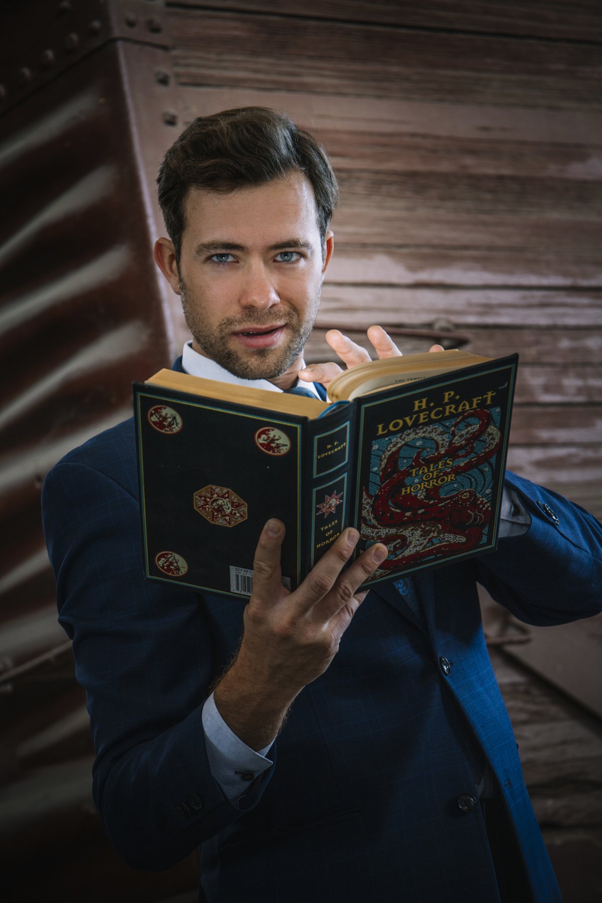 Dylan George reading from an H.P. Lovecraft book for a book test