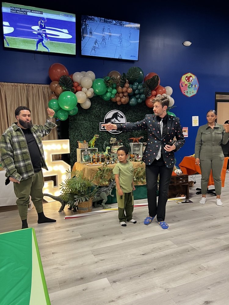 Dylan George performing at a kids birthday party