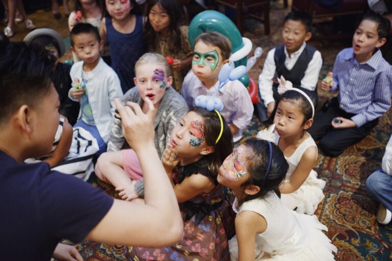 Johnny Wu performing a magic show for kids at a birthday party