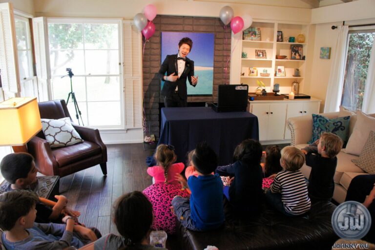 Johnny Wu performing a magic show for kids at a birthday party