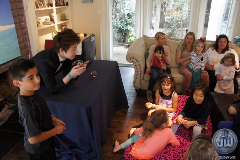 Johnny Wu performing a magic show for kids at a birthday party