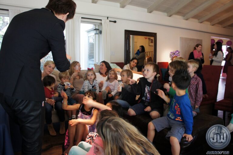 Johnny Wu performing a magic show for kids at a birthday party