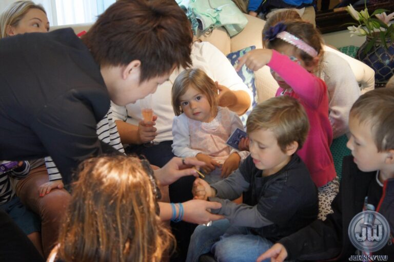 Johnny Wu performing a magic show for kids at a birthday party
