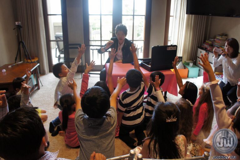 Johnny Wu performing a magic show for kids at a birthday party