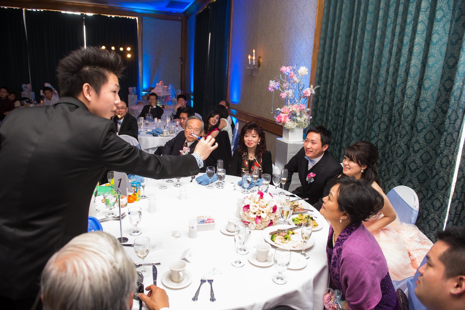 Johnny Wu performing close up magic for guests