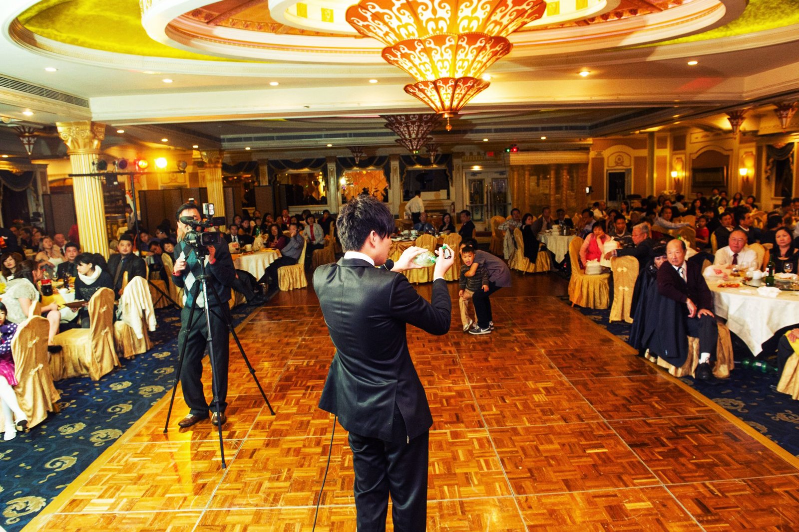 Johnny Wu performing for a banquet audience