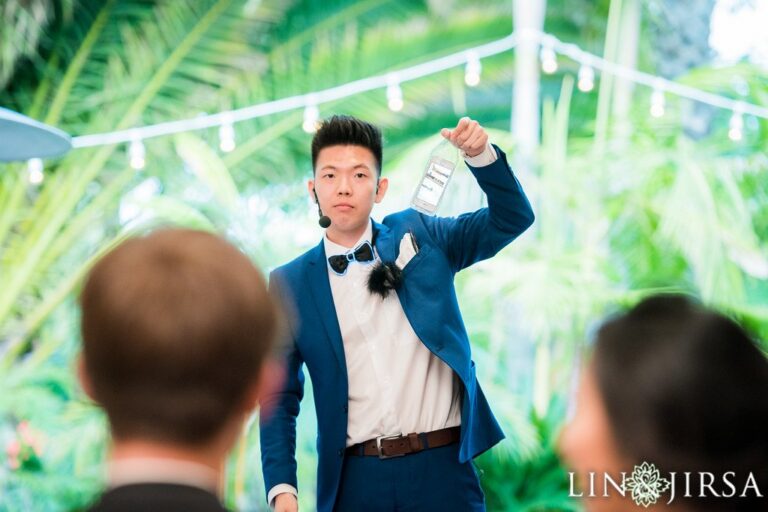 Johnny Wu performing magic for guests at a wedding