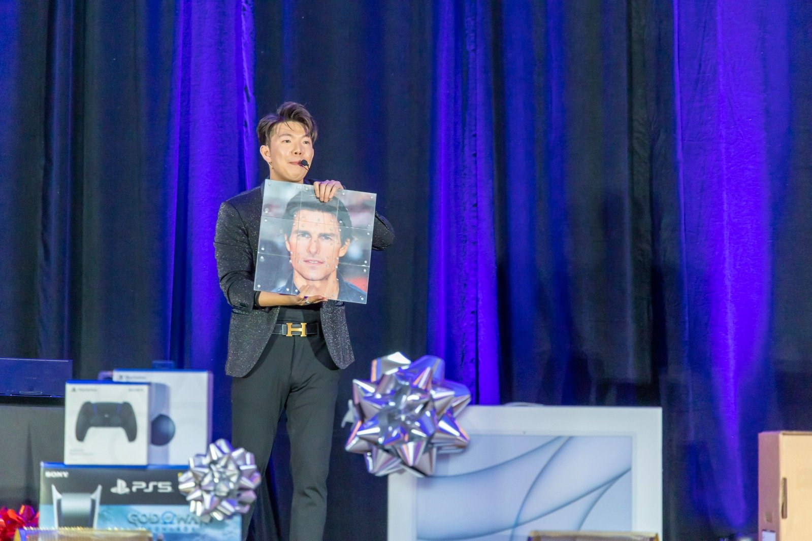 Johnny Wu performing on stage at a corporate event