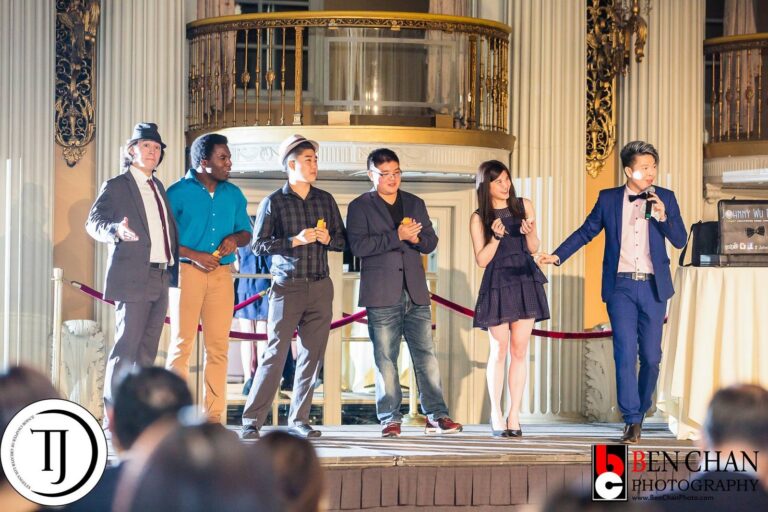 Johnny Wu performing on stage at a gala