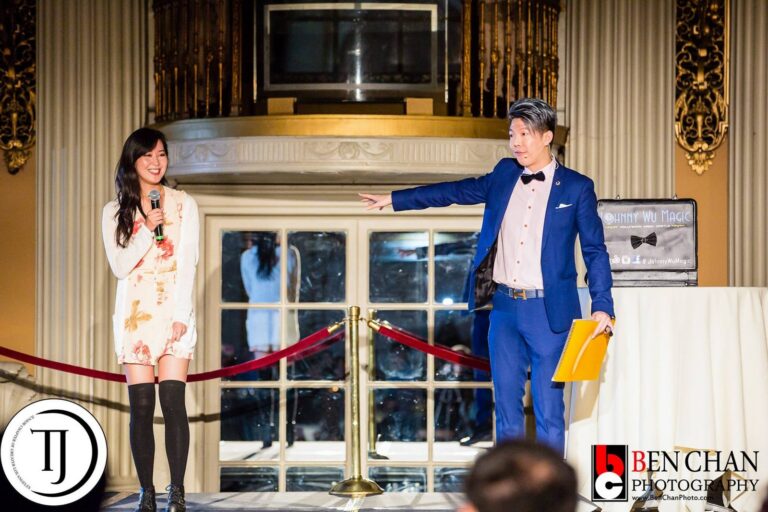 Johnny Wu performing on stage at a gala