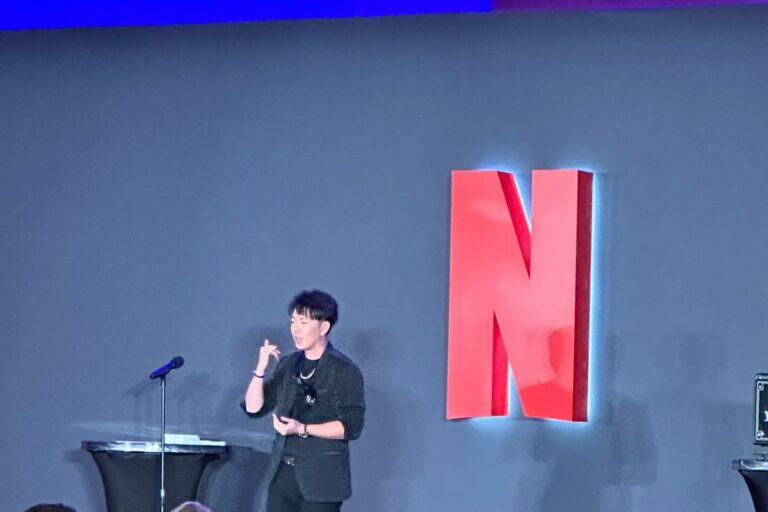 Johnny Wu performing on stage for Netflix