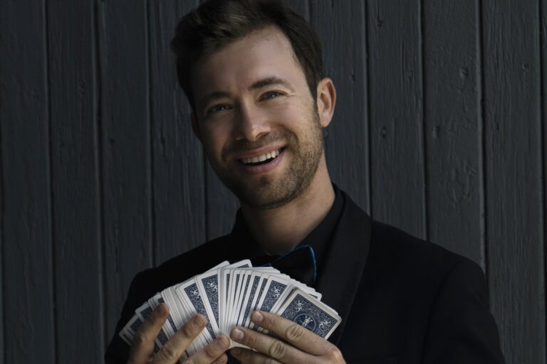 Omni Magic magician Dylan performing a card trick