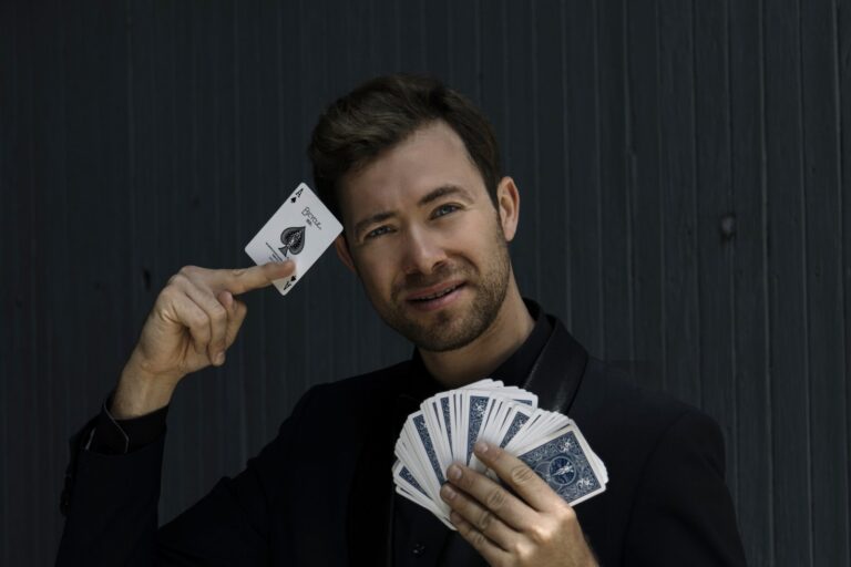 Omni Magic magician Dylan performing a card trick
