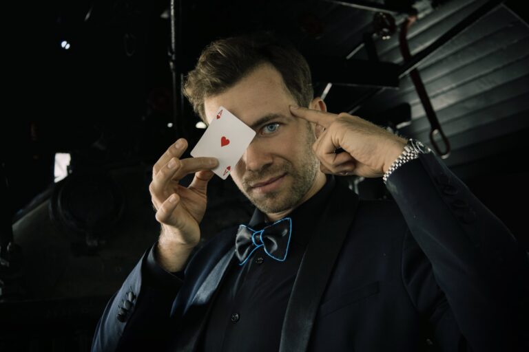 Omni Magic magician Dylan performing a card trick