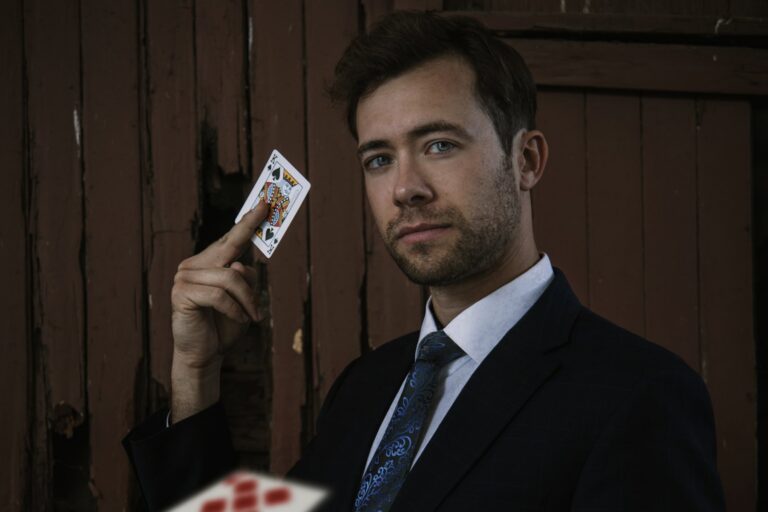 Omni Magic magician Dylan performing a card trick