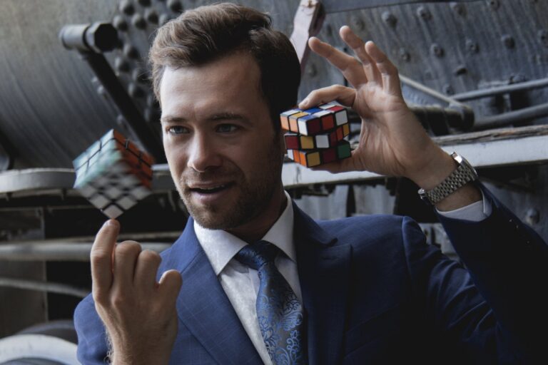 Omni Magic magician Dylan performing a card trick