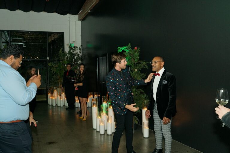 Omni Magic magician Dylan performing strolling magic at a holiday party