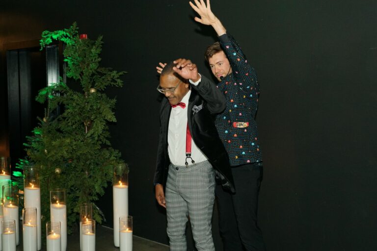Omni Magic magician Dylan performing strolling magic at a holiday party