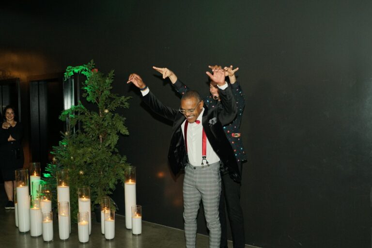 Omni Magic magician Dylan performing strolling magic at a holiday party