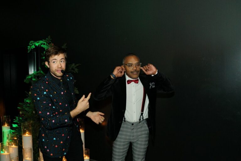 Omni Magic magician Dylan performing strolling magic at a holiday party